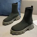 Detail view of women's olive green flyknit sock boots with thick lug soles - Army Green