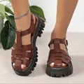 Close-up view of brown platform gladiator sandals with hollow-out design and thick soles - 36 / Roman Platform Sandals (A1008) / Brown