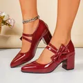 Detailed view of burgundy patent leather block heel shoes featuring an elegant bow detail - 35 / Burgundy