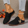 Elegant black women's mules featuring a gold metal buckle and artistic laser cutouts - 36 / Black