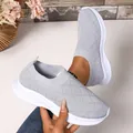 Detailed view of lightweight breathable grey knit slip-on sneakers with a non-slip soft sole - 36 / Gray