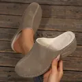 Close-up of women's taupe suede mules showing warm white fleece lining and stitching - 36 / Khaki