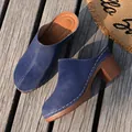 Close-up of blue suede package-toe mules with chunky wooden texture high heels on wood deck - 36 / Blue