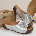 Elegant silver women's wedge sandals featuring a large 3D flower and open toe design - Silver