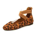 Close-up side profile of leopard print round toe flats with elastic cross straps. - Leopard Print