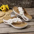 Stylish white wedge flip-flops for women featuring elegant floral decorations and thong straps - White