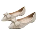 Elegant champagne pointed toe flat shoes featuring decorative bow and shimmering crystals - 34 / Apricot
