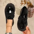 Retro black patent leather loafers with large bows and thick platform lug soles. - 36 / Black