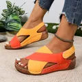 Vibrant orange and yellow color-blocked women's wedge sandals detail view on feet - 36 / Orange