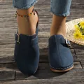 Close-up of navy blue suede clogs with buckle strap on a wooden deck - 36 / Dark Blue