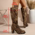 Leopard print knee-high boots featuring chunky high heel and specific dimension markings - Leopard Print
