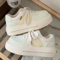 Side view of campus-style platform sneakers with light green and yellow color accents - 35 / Green