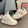 Close-up of white platform sneakers with pink star detail and thick rope laces. - 35 / Pink