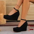 Elegant black suede wedge heels featuring round toe platform and 10cm ankle strap design - 36 / Black