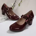 Elegant wine red patent leather Mary Jane shoes with thick high heels and bow detail. - 35 / Burgundy