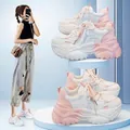 Detailed view of women's chunky dad shoes in pink and white color-block with thick soles - 35 / Pink