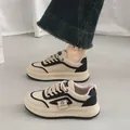 Detail view of chunky Korean-style beige sneakers with thick platform soles for casual wear - 35 / Black