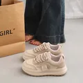 Detailed macro view of beige chunky platform sneakers with casual street style vibes. - 35 / Off White