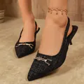 Close-up of elegant black tweed pointed toe slingback heels with a decorative gold buckle - 36 / Black