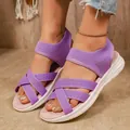 Close-up detail of purple breathable elastic cross-strap sandals with white sole - 36 / Purple