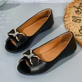 Elegant black peep-toe flat shoes featuring a rhinestone-studded bow and gold accents - 35 / Black