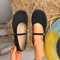 Top view of black suede Mary Jane shoes with round toe and adjustable strap - 35 / Black