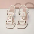 Elegant white high-heel sandals with geometric hollow-out design and elastic strap - 36 / White