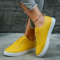 Bright yellow women's casual flat sneakers featuring white rubber soles and lace-up design - 35 / Yellow
