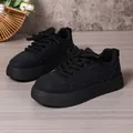 All-black chunky platform bread sneakers for women in a low-top casual leisure style. - Black