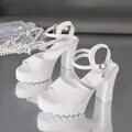 Elegant white chunky heel platform sandals featuring rhinestone straps and charm decoration - 35 / White