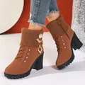 Detail of brown block heel ankle boots featuring knitted cuffs and rhinestone accents. - 35 / Orange