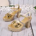 Elegant metallic gold block heel sandals with rhinestone straps and platform sole - 35 / Gold