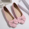 Elegant pink pointed-toe ballet flats featuring a large bow with crystal buckle - Pink