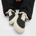 Men's handmade woven low-top casual sneakers with chunky cream laces on white background - 39 / Black