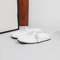 Elegant white woven mules featuring a round toe design and gold buckle strap flat heel - 36 / White