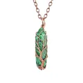 Close-up of handmade wire-wrapped malachite tree of life hexagonal pendant necklace - Malachite