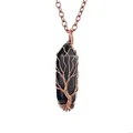 Detailed view of black hexagonal crystal pendant with handmade copper tree of life wire wrap - Obsidian