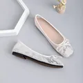 Detail view of elegant lace mesh ballet flats featuring square toe and delicate bow decoration - 35 / White