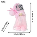 Pink plush holiday gnome figurine with Fight Cancer message and measurement labels - Pink Bow Gnome