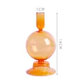 Bougeoir sphérique en verre orange ambré, hauteur 18 cm, ouverture supérieure de 1 cm. - Forme sphérique / Hauteur 18cm / Calibre 1cm / Jaune