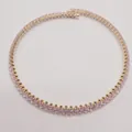 Detailed view of an elegant gold-plated necklace with pink oval-cut cubic zirconia - Pink