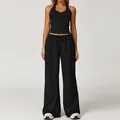 Ensemble de yoga noir deux pièces avec haut à licou et pantalon large à cordon - Noir Premium