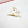 Medium matte cream hair claw clip featuring elegant twist design for chic women hair accessories - Cross Loop Style / White