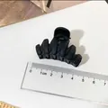Elegant matte black hair claw clip medium size shown with ruler for size reference - Fishbone Style / Black