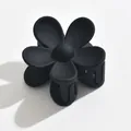 Elegant matte black flower-shaped medium hair claw clip for stylish half-up hairstyles - Sunflower Style / Black