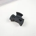 Elegant matte black bow-shaped hair claw clip, medium size for classic half-up hairstyles - Bowtie / Black