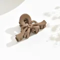 Elegant matte brown bow-shaped hair claw clip in medium size for stylish half-up hairstyles - Streamer Style / Light Coffee