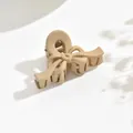Elegant matte beige bow-shaped hair claw clip for medium-thick hair styling and daily use. - Streamer Style / Khaki