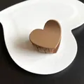 Matte brown heart-shaped hair claw clip presented on a white decorative heart plate - Heart Style / Light Coffee