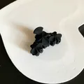 Elegant matte black medium-sized hair claw clip featuring a classic floral clover design for women - Three Flowers Style / Black